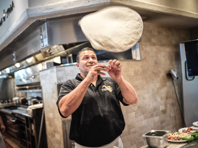 food photography of chef making pizza